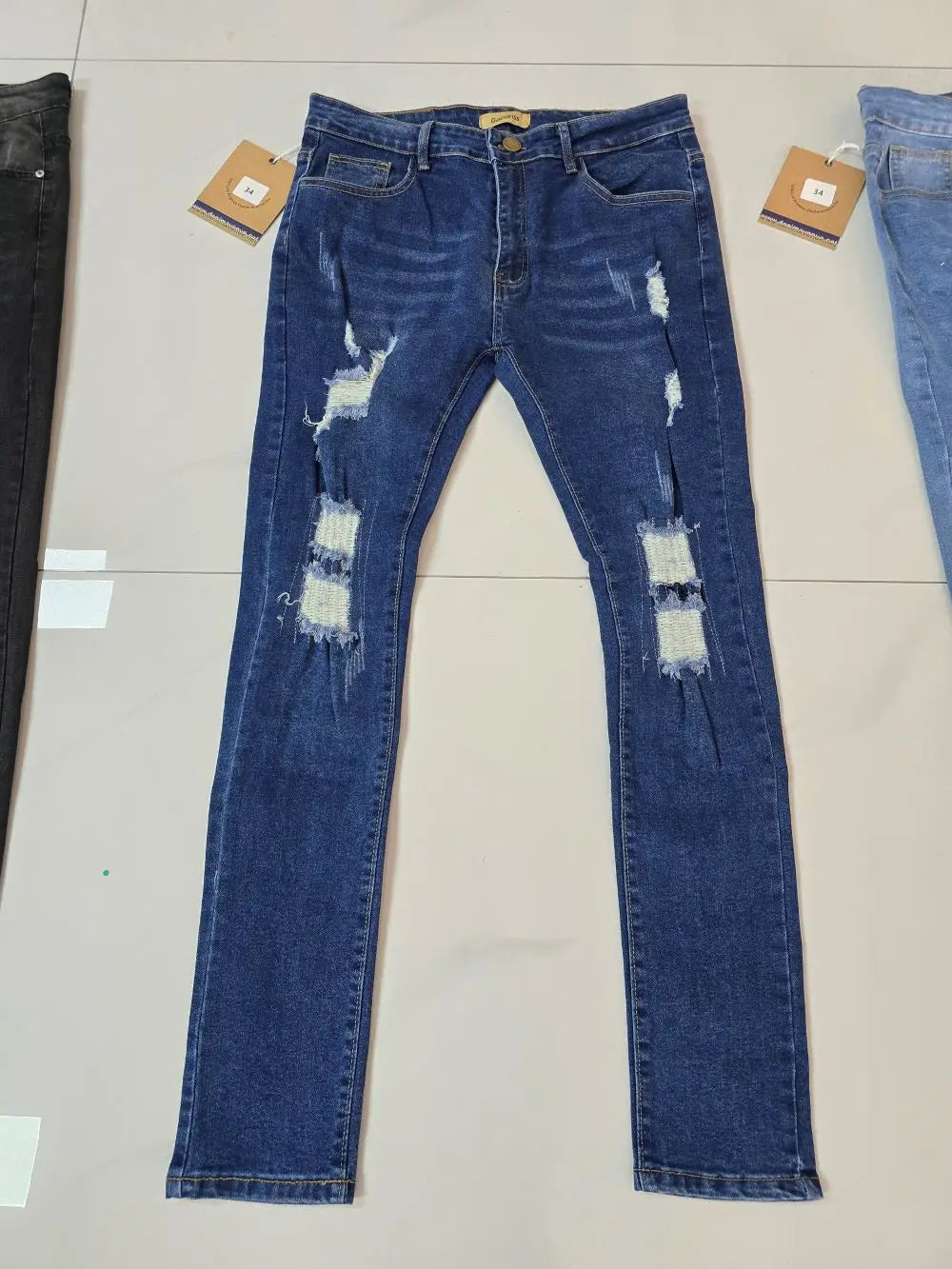 Wholesale large-sized men's jeans with zipper pockets, fashionable and tattered blue and black jeans, men's washed craft jeans